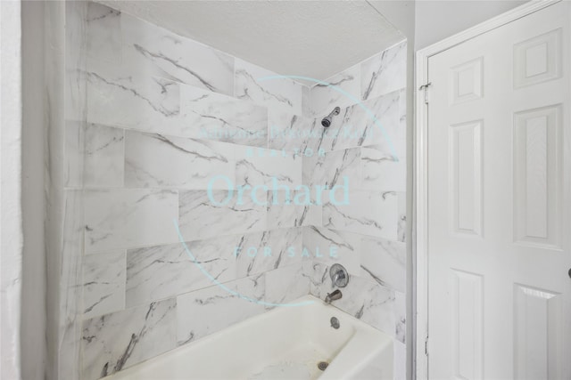 9196 White Oak Dr, Conroe, TX 77384 - full bath with  shower combination and a textured ceiling