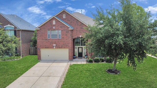11311 Burmese Ln, Sugar Land, TX 77478 - traditional-style house with brick siding, an attached garage, driveway, and a front lawn
