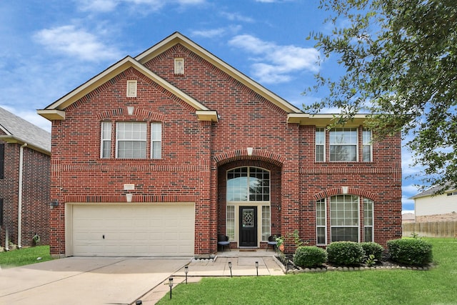 11311 Burmese Ln, Sugar Land, TX 77478 - traditional-style home featuring a garage, brick siding, concrete driveway, and a front lawn