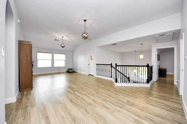 11311 Burmese Ln, Sugar Land, TX 77478 - unfurnished room with attic access, baseboards, and light wood finished floors