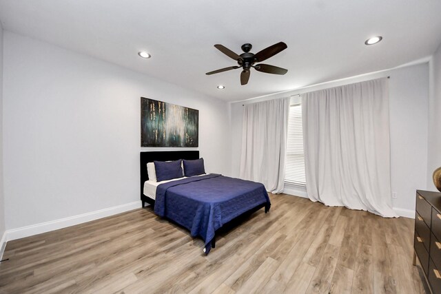 11311 Burmese Ln, Sugar Land, TX 77478 - bedroom with wood finished floors, recessed lighting, baseboards, and ceiling fan