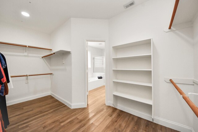 11311 Burmese Ln, Sugar Land, TX 77478 - walk in closet featuring wood finished floors