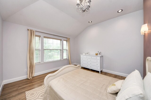 11311 Burmese Ln, Sugar Land, TX 77478 - bedroom featuring lofted ceiling, wood finished floors, baseboards, recessed lighting, and a chandelier