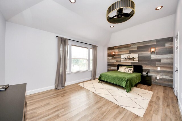 11311 Burmese Ln, Sugar Land, TX 77478 - bedroom with vaulted ceiling, wood finished floors, recessed lighting, wood walls, and baseboards