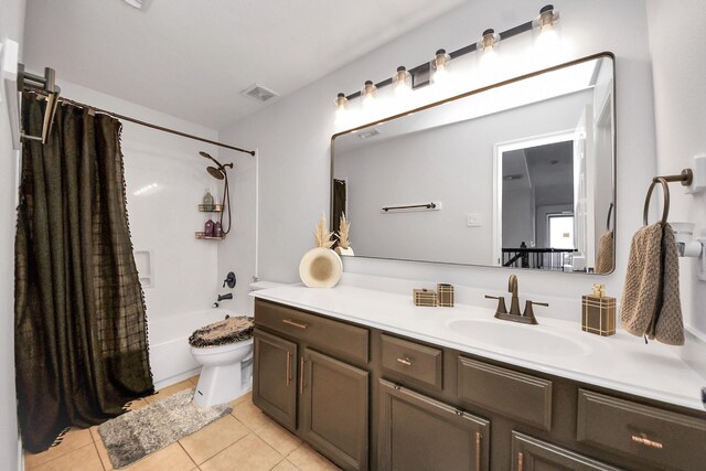 11311 Burmese Ln, Sugar Land, TX 77478 - bathroom with vanity, tile patterned flooring, toilet, and shower / bathtub combination with curtain