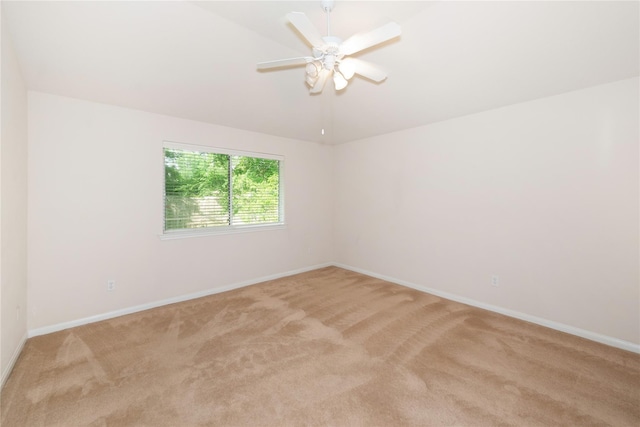 3226 Woodwind Rd, Montgomery, TX 77356 - spare room featuring light carpet, a ceiling fan, and vaulted ceiling