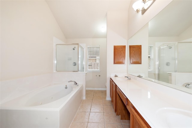 3226 Woodwind Rd, Montgomery, TX 77356 - full bath featuring vaulted ceiling, a jetted tub, a shower stall, double vanity, and tile patterned flooring