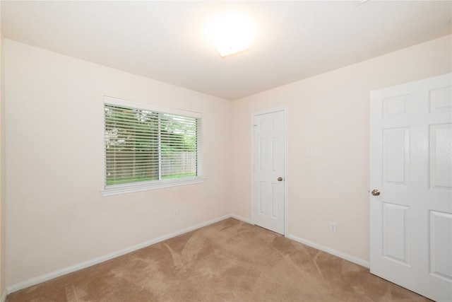 3226 Woodwind Rd, Montgomery, TX 77356 - unfurnished bedroom featuring light colored carpet and baseboards