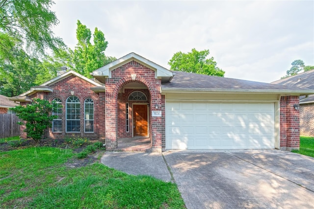 3226 Woodwind Rd, Montgomery, TX 77356 - view of front of property featuring brick siding, concrete driveway, a garage, and roof with shingles