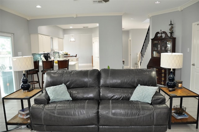 14134 Palo Seco Dr, Corpus Christi, TX 78418 - living room featuring stairs, crown molding, and recessed lighting