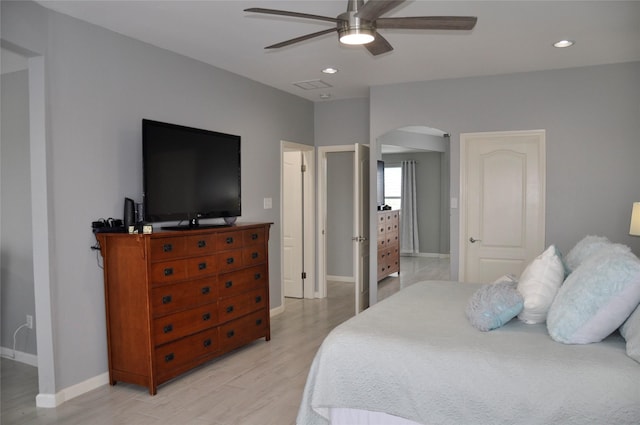 14134 Palo Seco Dr, Corpus Christi, TX 78418 - bedroom with arched walkways, light wood finished floors, baseboards, recessed lighting, and a ceiling fan