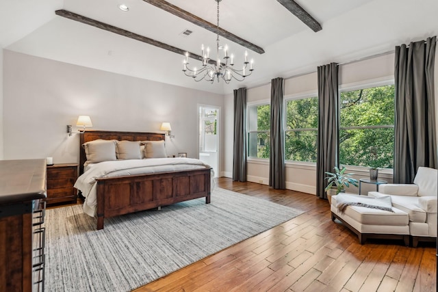 6014 Floyd St, Houston, TX 77007 - bedroom with a chandelier, multiple windows, and hardwood / wood-style flooring