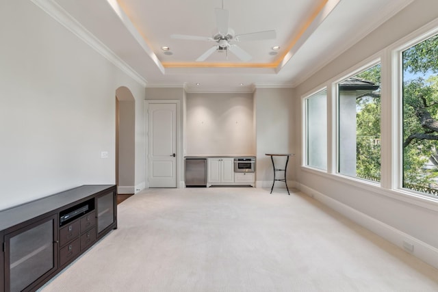 6014 Floyd St, Houston, TX 77007 - spare room featuring a tray ceiling, light carpet, arched walkways, recessed lighting, and ornamental molding