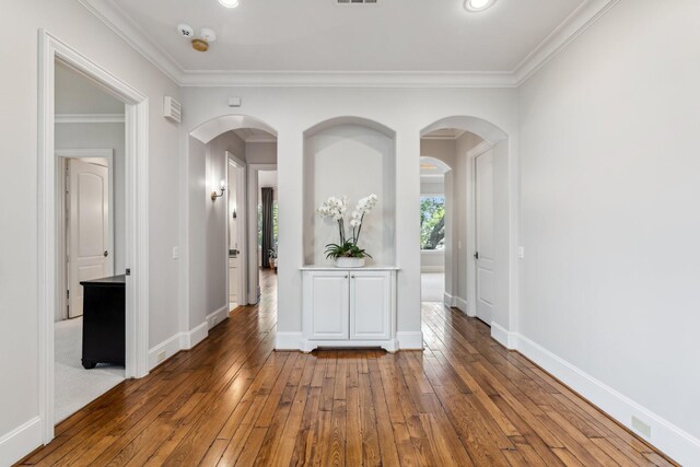6014 Floyd St, Houston, TX 77007 - empty room with arched walkways, hardwood / wood-style flooring, ornamental molding, and recessed lighting
