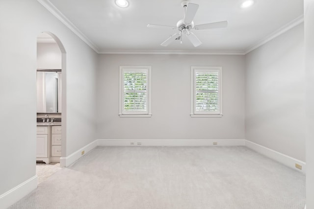 6014 Floyd St, Houston, TX 77007 - empty room featuring arched walkways, light carpet, ceiling fan, crown molding, and recessed lighting