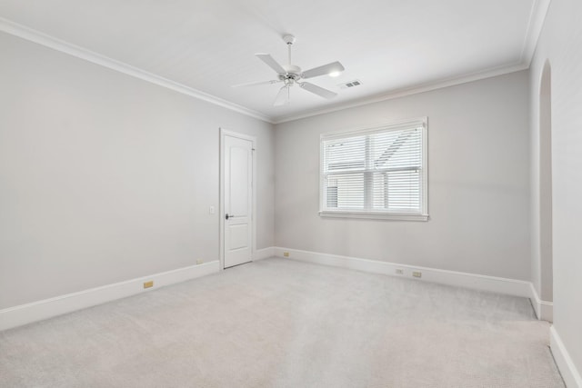 6014 Floyd St, Houston, TX 77007 - spare room featuring light colored carpet, ceiling fan, crown molding, and arched walkways