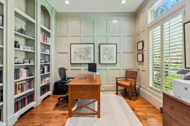 6014 Floyd St, Houston, TX 77007 - office featuring a decorative wall, light wood-style floors, and recessed lighting