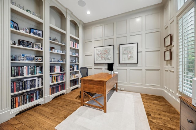6014 Floyd St, Houston, TX 77007 - office featuring a decorative wall, light wood-type flooring, and recessed lighting