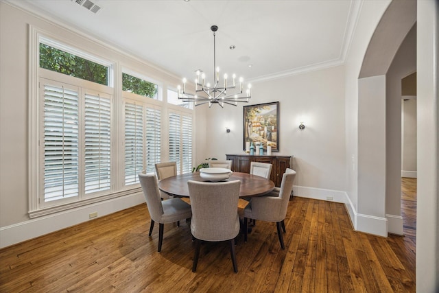 6014 Floyd St, Houston, TX 77007 - dining area with a chandelier, wood finished floors, and ornamental molding