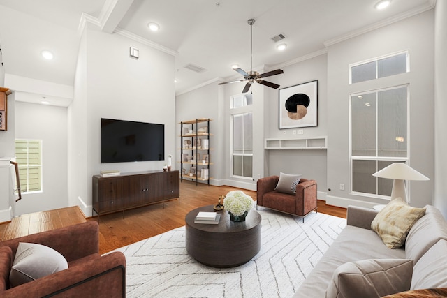 2022 Sabine St, Houston, TX 77007 - living area with wood finished floors, ornamental molding, ceiling fan, recessed lighting, and baseboards