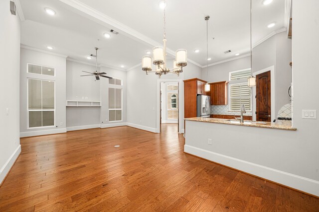 2022 Sabine St, Houston, TX 77007 - kitchen featuring stainless steel refrigerator with ice dispenser, a chandelier, ornamental molding, recessed lighting, and baseboards