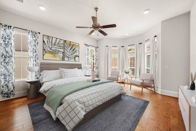 2022 Sabine St, Houston, TX 77007 - bedroom featuring baseboards, light wood-type flooring, recessed lighting, and ceiling fan
