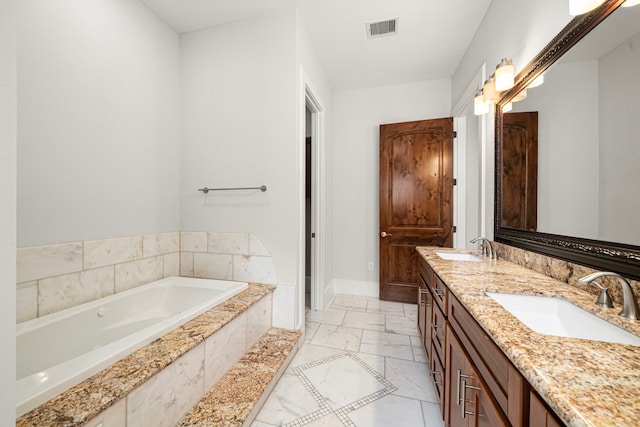 2022 Sabine St, Houston, TX 77007 - bathroom with double vanity, a garden tub, marble look tiles, and baseboards
