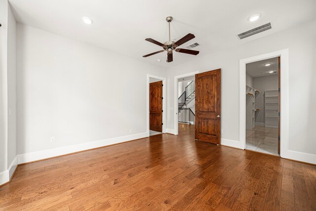 2022 Sabine St, Houston, TX 77007 - unfurnished bedroom featuring wood finished floors, baseboards, recessed lighting, and a ceiling fan
