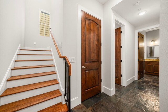 2022 Sabine St, Houston, TX 77007 - stairway featuring stone tile flooring and baseboards