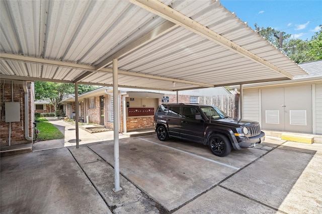 1106 W Tri Oaks Ln Unit 134, Houston, TX 77043 - garage featuring covered parking
