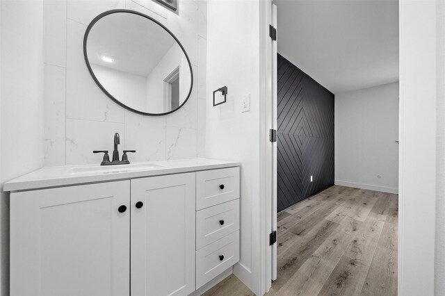 1106 W Tri Oaks Ln Unit 134, Houston, TX 77043 - bathroom featuring vanity and wood finished floors