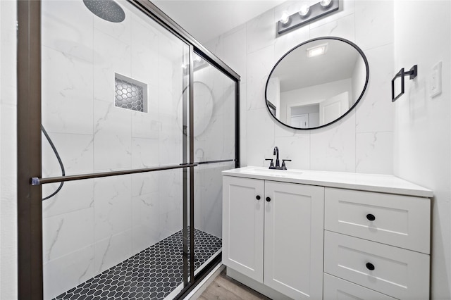 1106 W Tri Oaks Ln Unit 134, Houston, TX 77043 - full bath with a shower stall, vanity, and wood finished floors