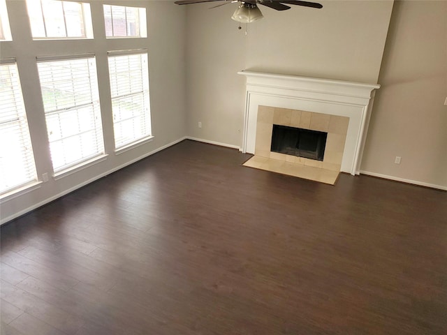 1126 Indian Autumn Trce, Houston, TX 77062 - unfurnished living room featuring a ceiling fan, plenty of natural light, baseboards, and dark wood-style flooring