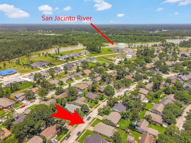 20110 Misty Pines Dr, Humble, TX 77346 - aerial perspective of suburban area featuring a heavily wooded area and a large body of water