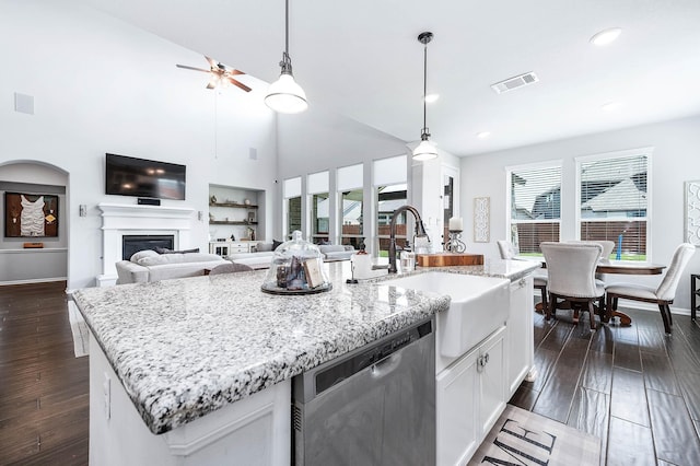 23230 Banfield Creek Ct, Katy, TX 77493 - kitchen featuring dishwasher, a sink, a center island with sink, a ceiling fan, and light stone counters