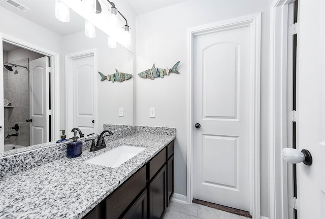 23230 Banfield Creek Ct, Katy, TX 77493 - bathroom featuring vanity, tile patterned floors, baseboards, and tub / shower combination