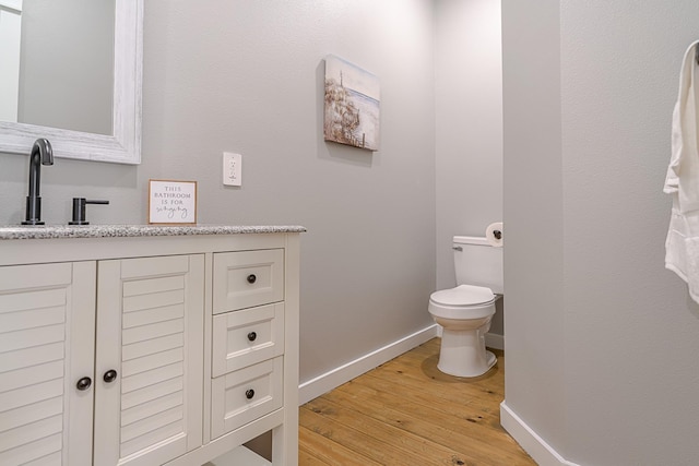 1088 Johnson Rd, Gilchrist, TX 77617 - bathroom with hardwood / wood-style flooring and vanity