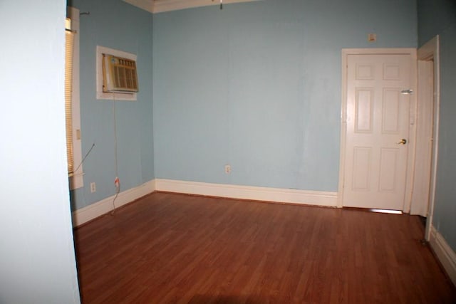 1611 Chapman St, Houston, TX 77009 - spare room with wood finished floors, baseboards, and a wall mounted AC