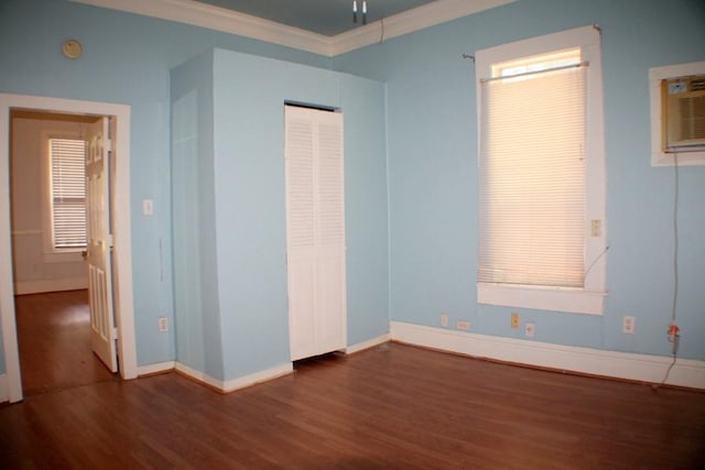 1611 Chapman St, Houston, TX 77009 - unfurnished bedroom featuring wood finished floors, baseboards, crown molding, and a closet