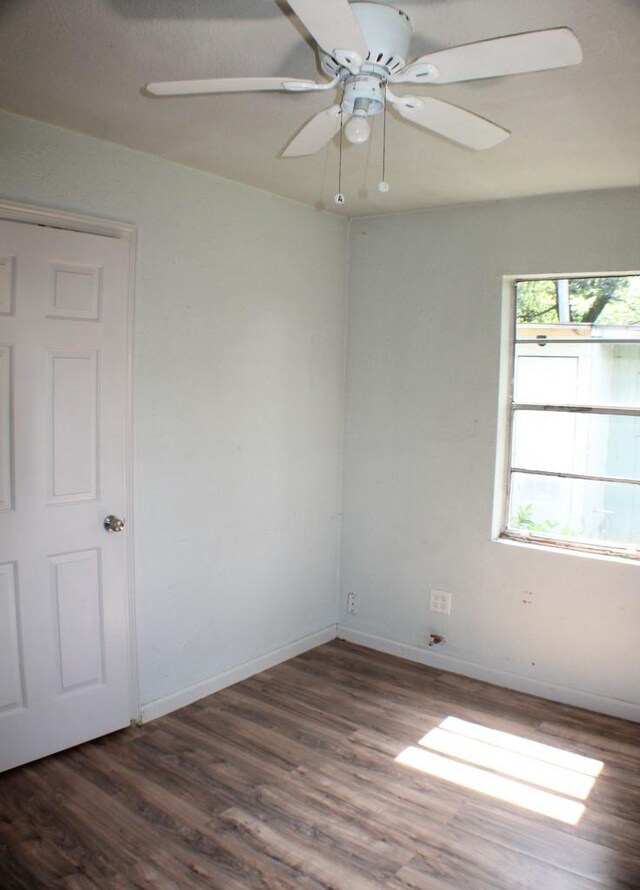1611 Chapman St, Houston, TX 77009 - unfurnished room featuring wood finished floors, baseboards, and a ceiling fan