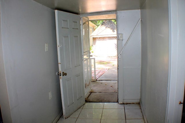 1611 Chapman St, Houston, TX 77009 - doorway to outside with baseboards and light tile patterned floors