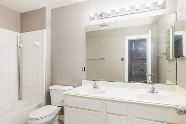 2705 Salt Grass Cir, Deer Park, TX 77536 - full bathroom featuring double vanity, toilet, and bathtub / shower combination
