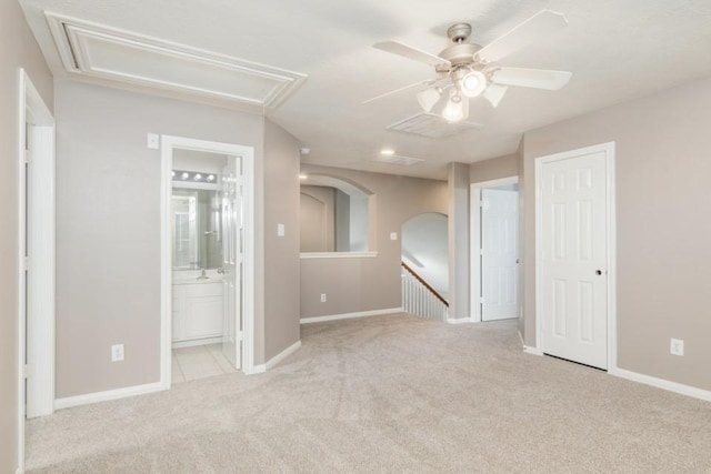 2705 Salt Grass Cir, Deer Park, TX 77536 - carpeted empty room featuring attic access, a ceiling fan, baseboards, and arched walkways