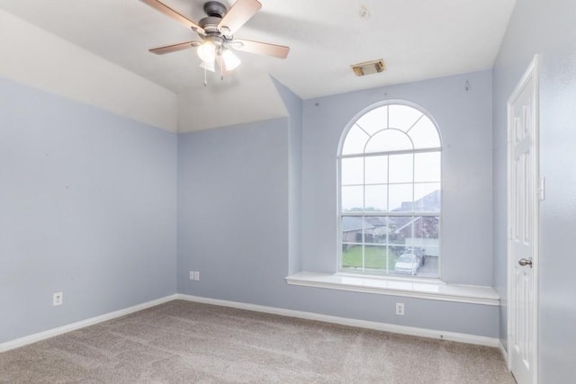 2705 Salt Grass Cir, Deer Park, TX 77536 - carpeted empty room featuring plenty of natural light, a ceiling fan, and baseboards