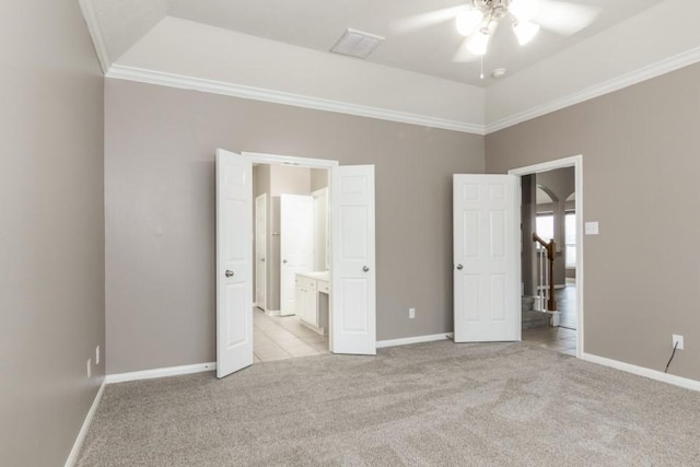 2705 Salt Grass Cir, Deer Park, TX 77536 - unfurnished bedroom featuring light colored carpet, baseboards, crown molding, and connected bathroom