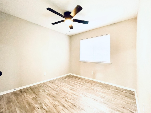 16303 Napa Vine Dr, Houston, TX 77053 - empty room with wood finished floors, ceiling fan, and baseboards