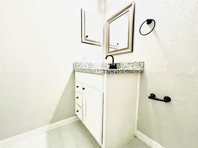 16303 Napa Vine Dr, Houston, TX 77053 - bathroom featuring vanity and baseboards