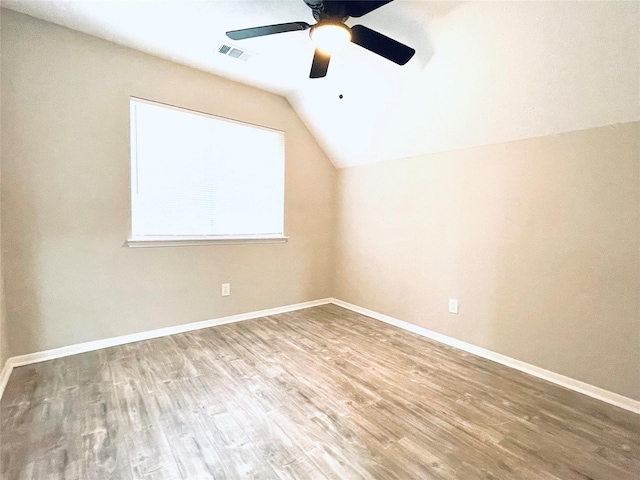16303 Napa Vine Dr, Houston, TX 77053 - empty room featuring a ceiling fan, vaulted ceiling, wood finished floors, and baseboards