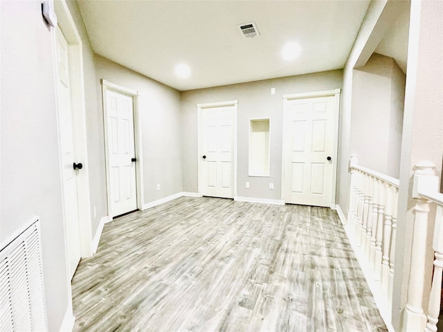 16303 Napa Vine Dr, Houston, TX 77053 - unfurnished bedroom with light wood finished floors and baseboards