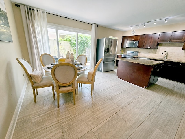 12645 Rip Van Winkle Dr Unit 26, Houston, TX 77024 - dining space with baseboards